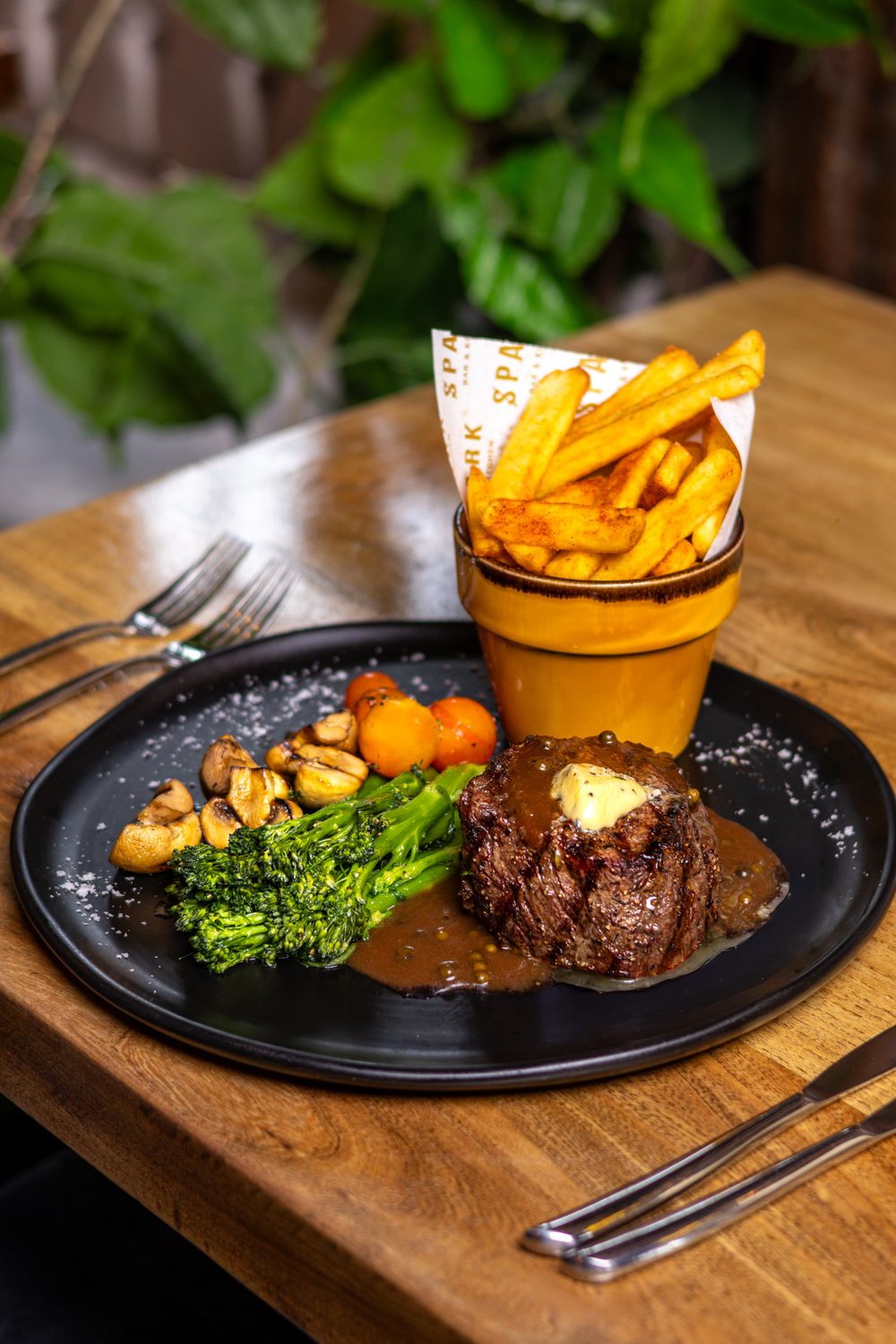 Steak with chips, broccoli and mushrooms at Spark Bar & Kitchen